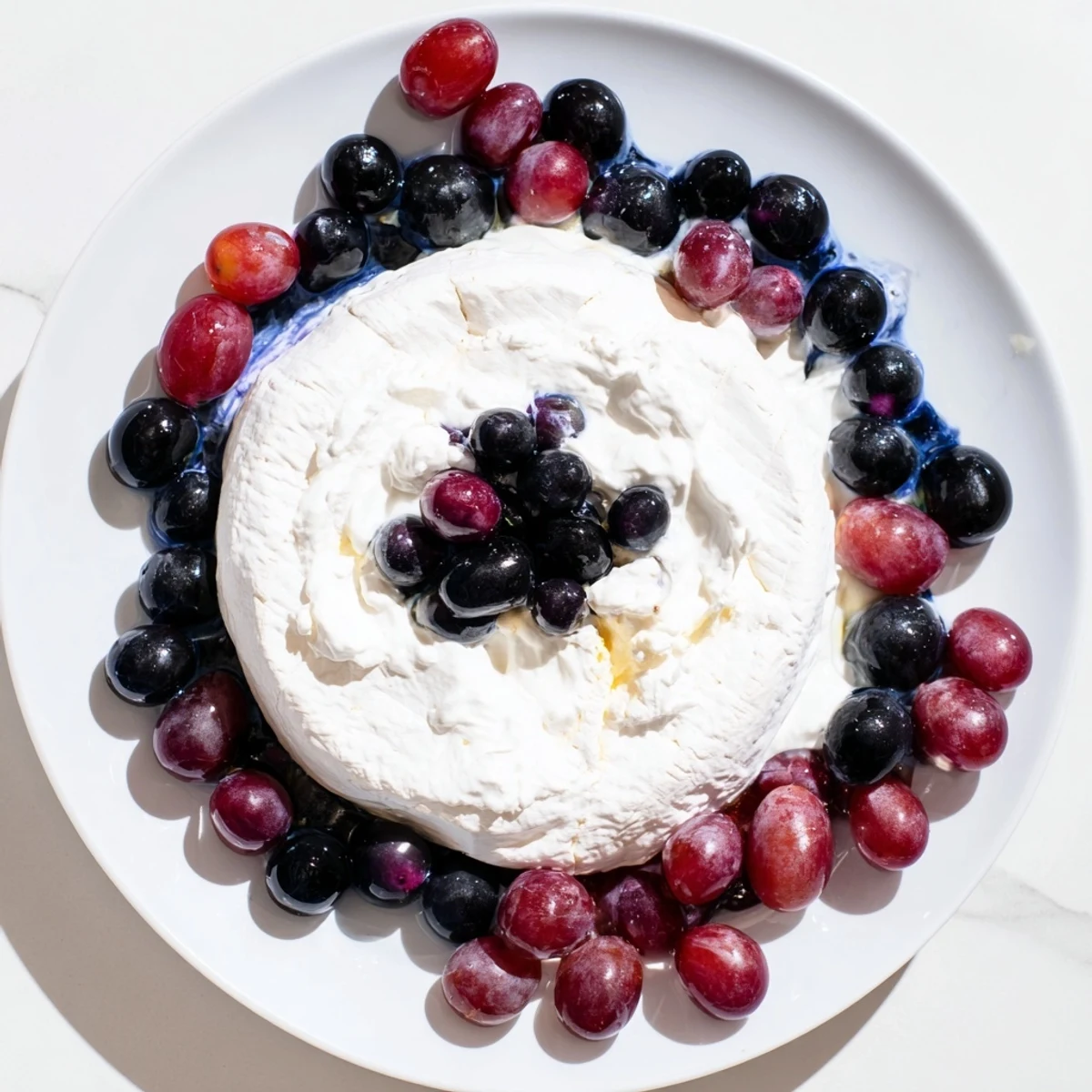Floating Island recipe: A stunning cheese wheel "island" afloat in a vibrant blue yogurt "sea."