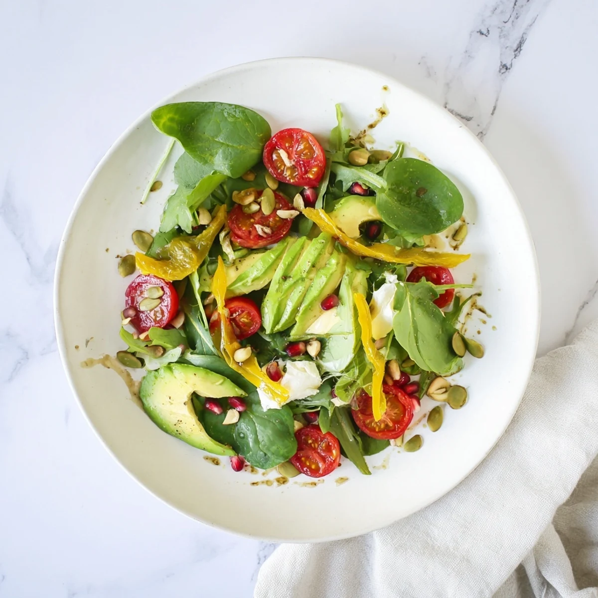 Golden Ratio Salad, a visually appealing vegetarian salad with vibrant tomatoes and creamy avocado.