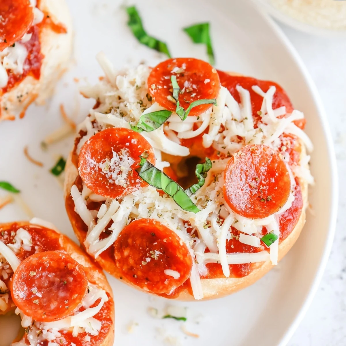 Mini Pepperoni Pizza Bagels fresh from the oven, bubbling cheese and crispy pepperoni atop toasted bagels.