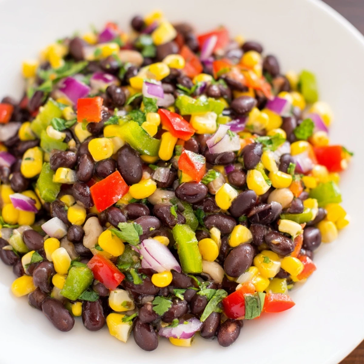 Chilled Cowboy Caviar Salad with crunchy corn and fresh cilantro is ready to enjoy.