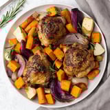Aromatic Honey-Glazed Chicken with Roasted Root Vegetables, glistening in a rich, sweet glaze.