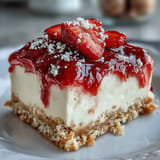 No-bake strawberry cheesecake bars with rich cream cheese layer and juicy fresh strawberries. Easy summer dessert for gatherings.  
