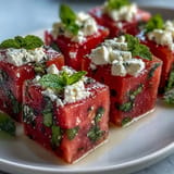 Refreshing cucumber watermelon feta bites with balsamic glaze, a delightful summer treat.