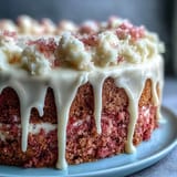 Luscious Rosé Velvet Cake with luscious frosting and shimmering edible gold accents.