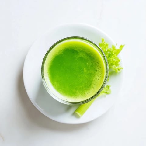 A close-up of Cabbage and Kale Detox Juice ingredients, including chopped kale, cabbage, and ginger, ready to be juiced for a nutrient-packed beverage.  